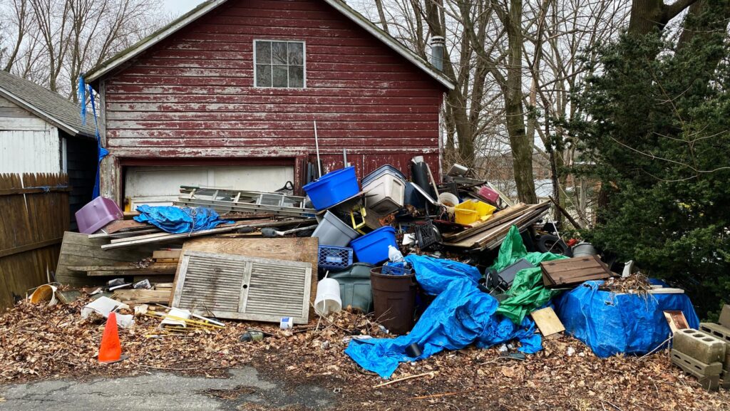 A home that needs piles of junk removed from the yard.